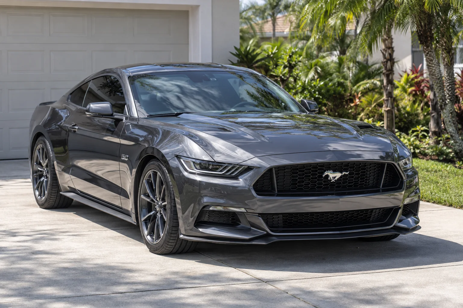 Graphite gray Ford Mustang with tinted windows at Dynamic Tinting Solution
