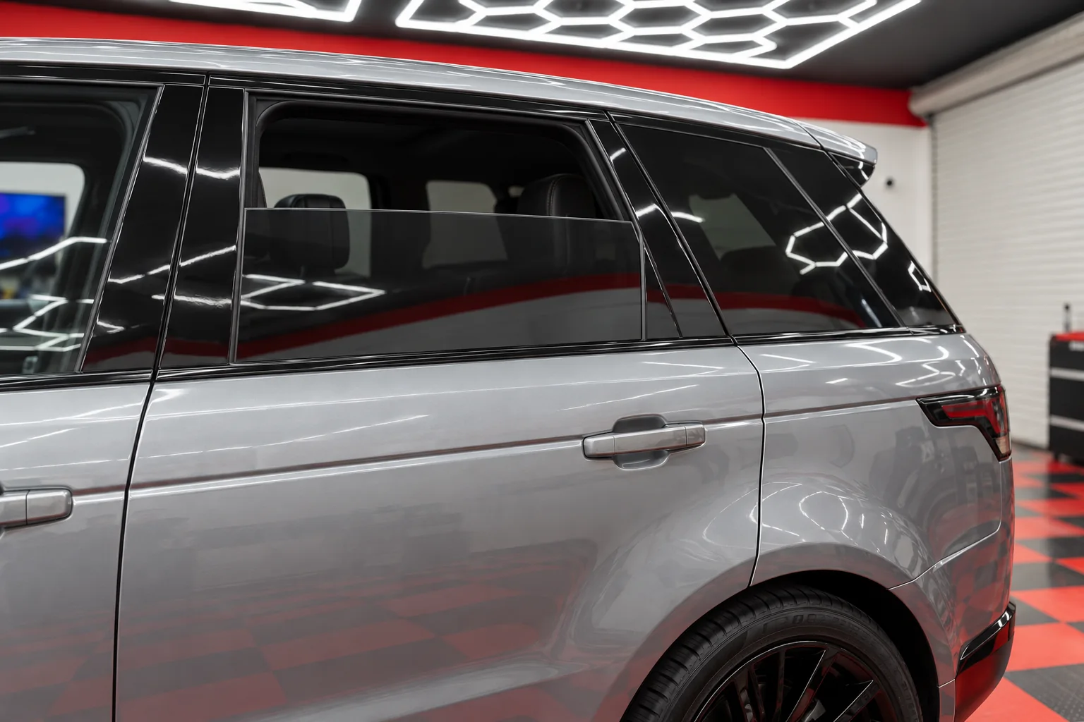 Liquid silver Range Rover Sport with tinted windows at Dynamic Tinting Solution