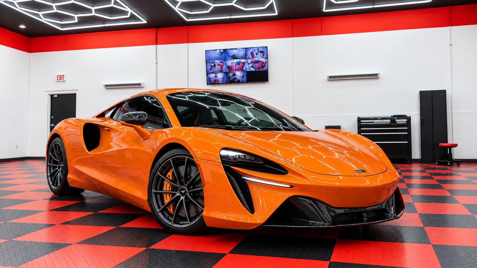 Papaya Spark McLaren Artura coupe with tinted windows at Dynamic Tinting Solution