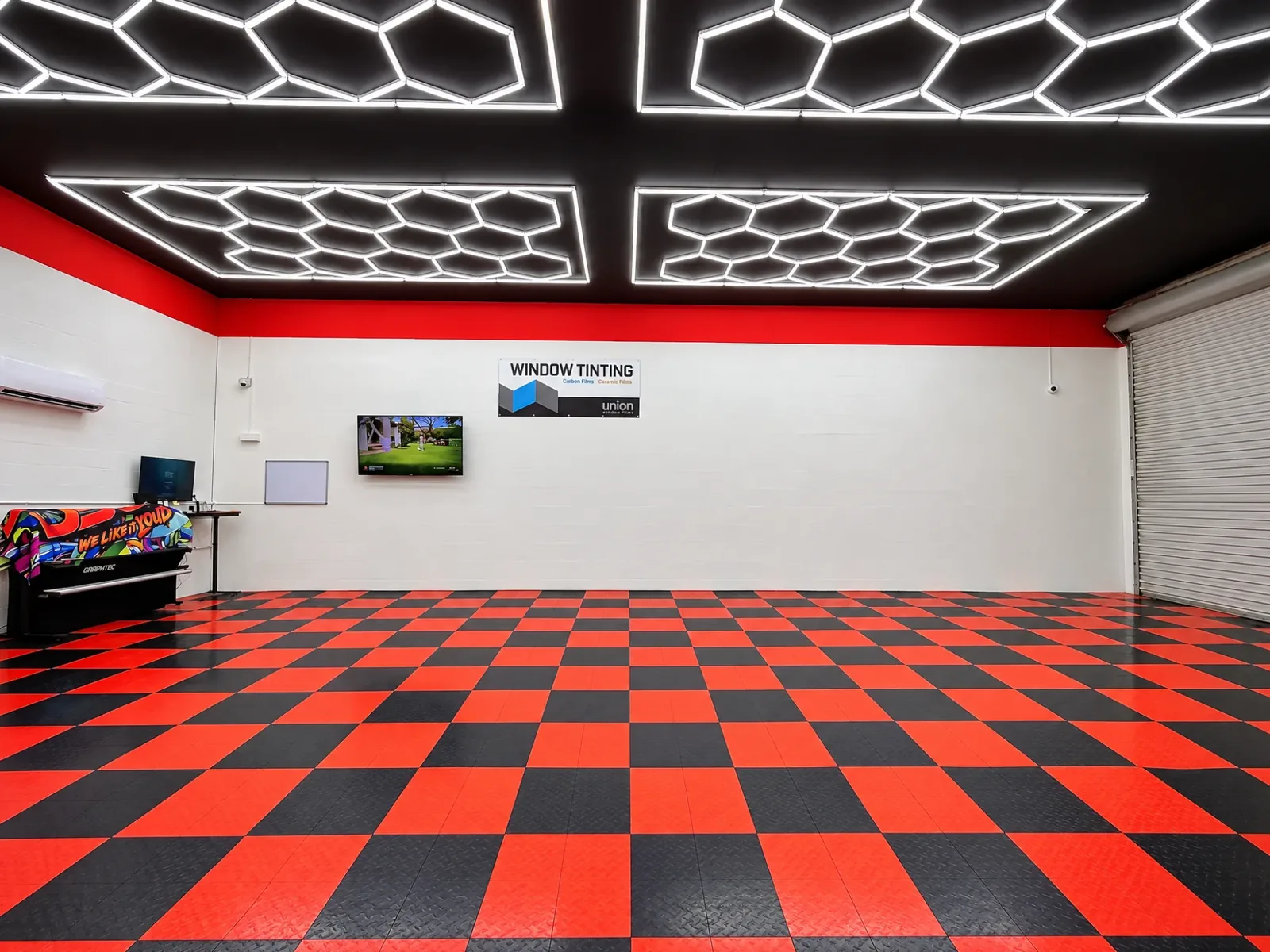 The Dynamic Tinting Solution shop in Largo, FL: hexagon lights over a checkered floor